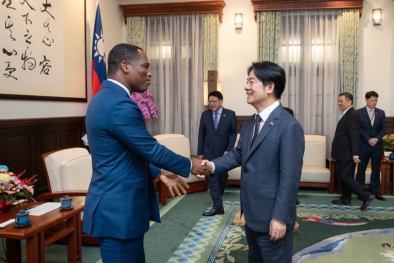 President Lai Ching-te shakes hands with Haiti Ambassador Roudy Stanley Penn.