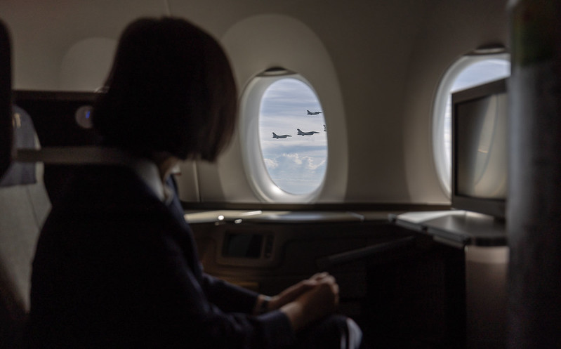 President Tsai looks out of the window at the fighter jets accompanying her plane.