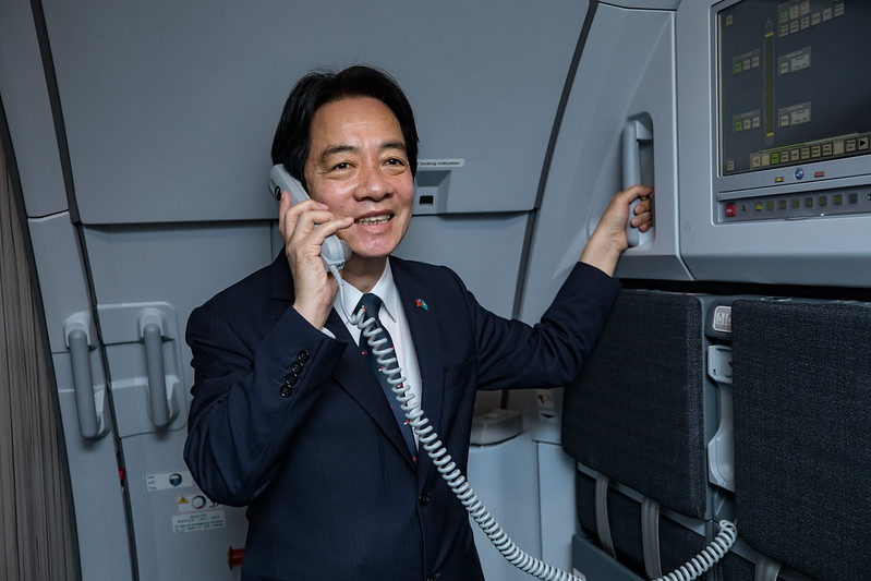 Vice President Lai delivers remarks over his charter flight's public address system.