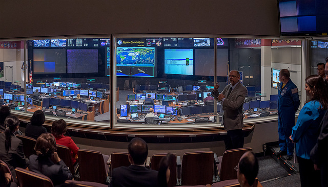 President Tsai listens to a briefing at the Johnson Space Center in Houston, Texas.