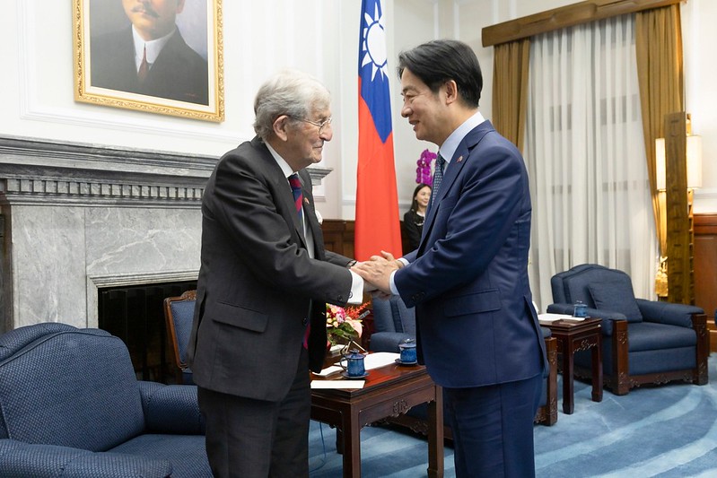 President Lai Ching-te shakes hands with co-chair of the APPG Lord Rogan.
