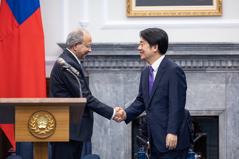 President Lai Ching-te shakes hands with Convenor of the Centre for Research on Strategic and Security Issues Pankaj Saran.